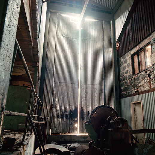 That's how the light gets in – through corrugated doors ajar at Lesjöfors bruk. Värmland, Sweden. April 2014.