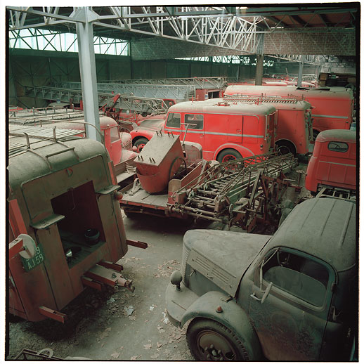 Not much parking space left in the old warehouse at Cimetière camions de pompiers, France. March 2015.