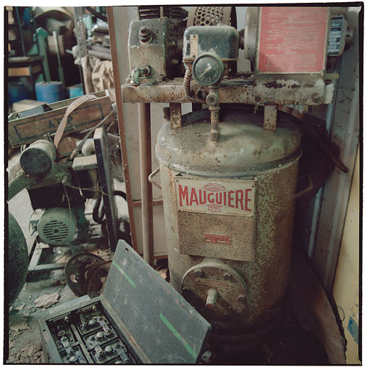 Maugiére compressor and an old battery in the workshop area at Cimetière camions de pompiers, France. March 2015.