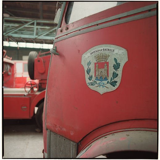 Arques-la-Bataille had a nicely hand painted symbol of the community on this truck at Cimetière camions de pompiers, France. March 2015.
