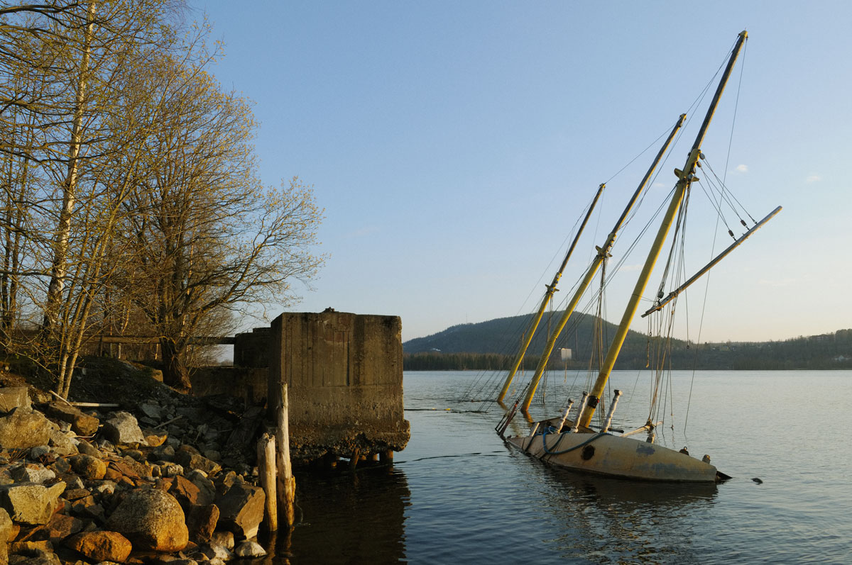 The half sunken schooner M/S Heri by the mill's dockside at Nyhamns sulfitfabrik. Essvik, Medelpad, Sweden. May 2008.